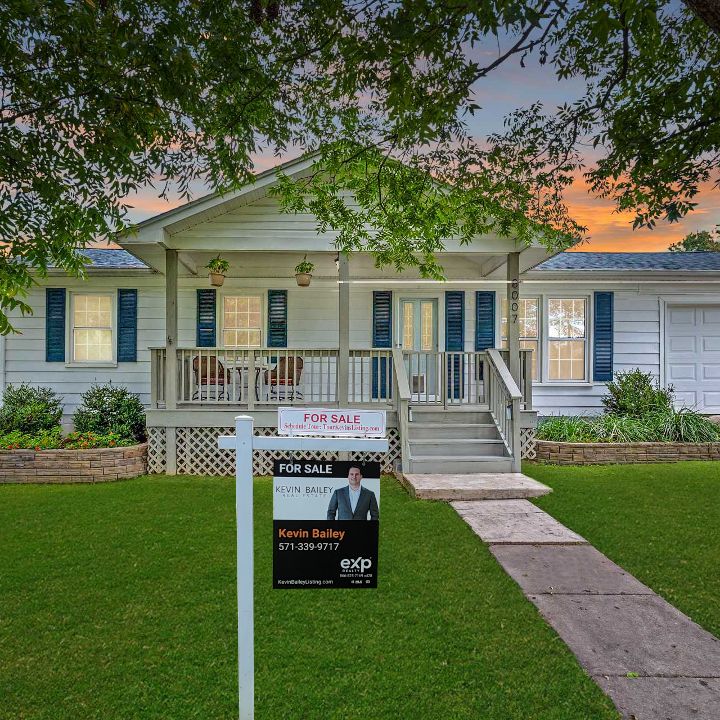 A home with Kevin Bailey’s for-sale sign in the front yard.
